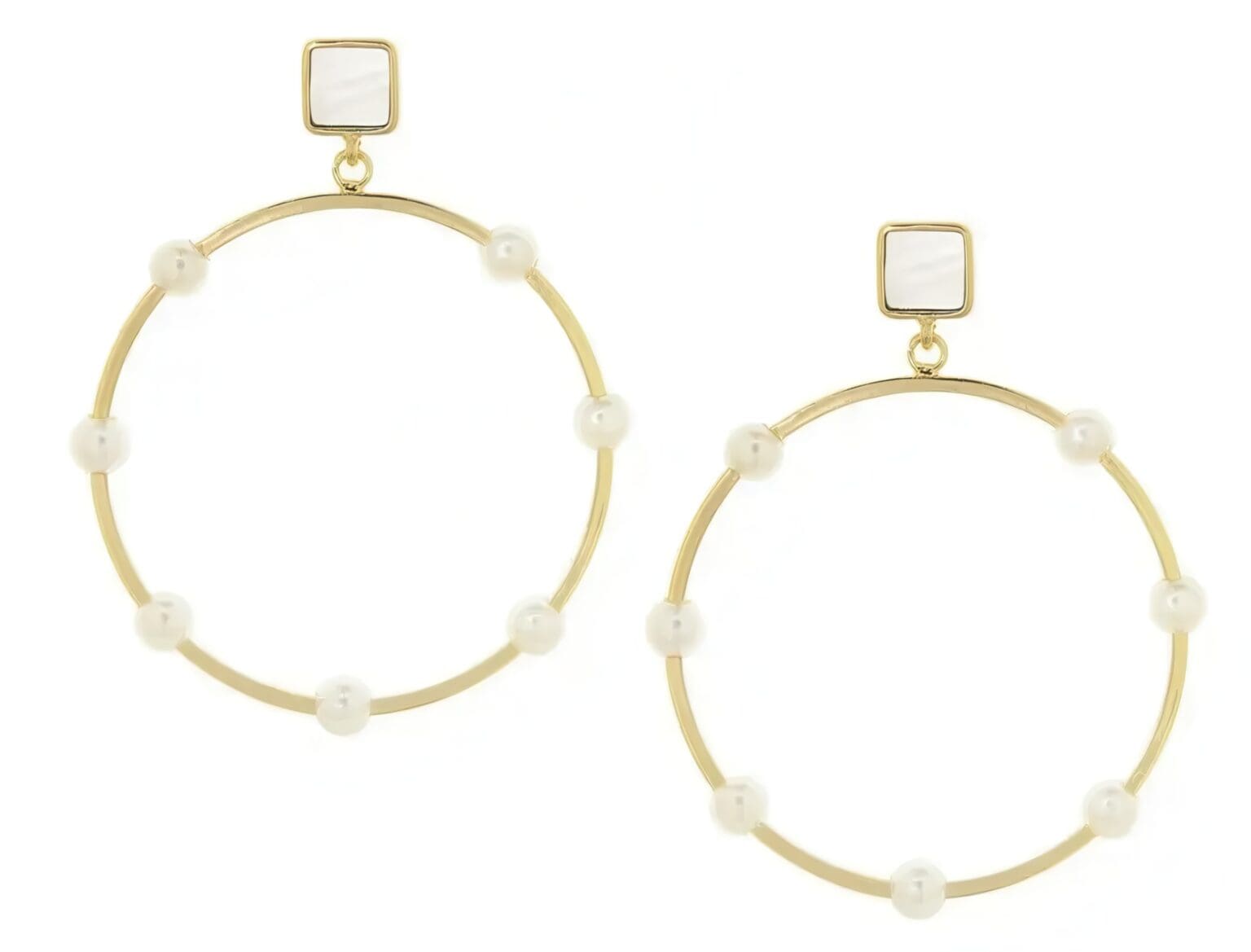 A pair of gold hoop earrings with white beads.