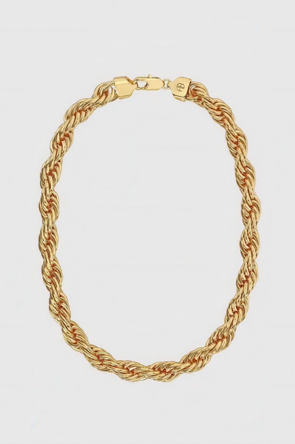 A gold chain necklace with a clasp on top of it.
