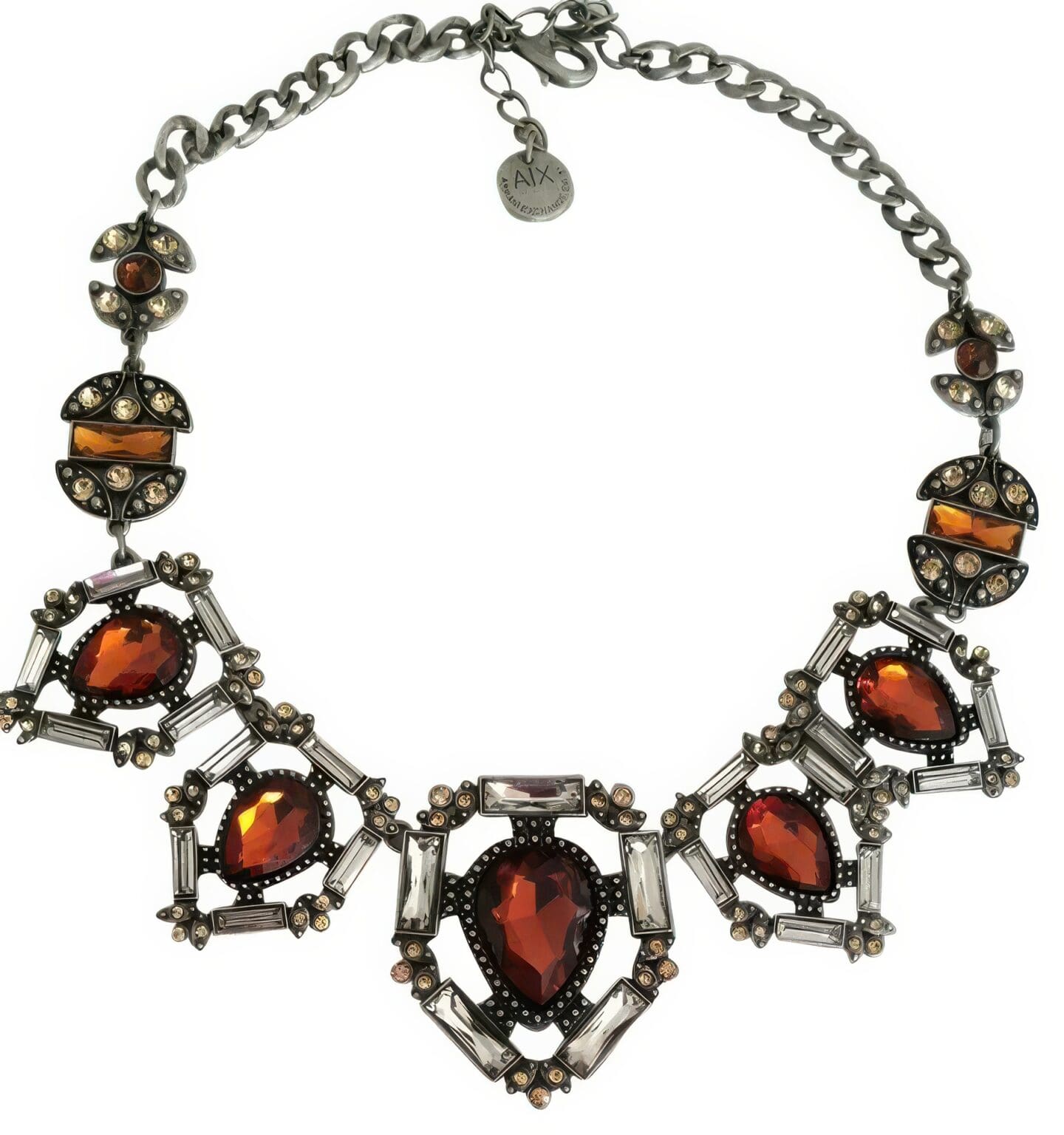 A necklace with red stones and clear rhinestones.