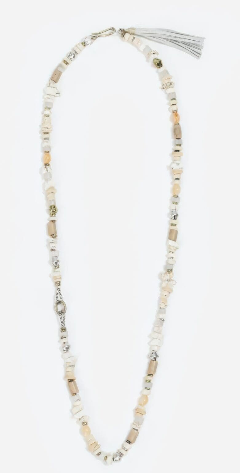 A necklace with a long chain and beads