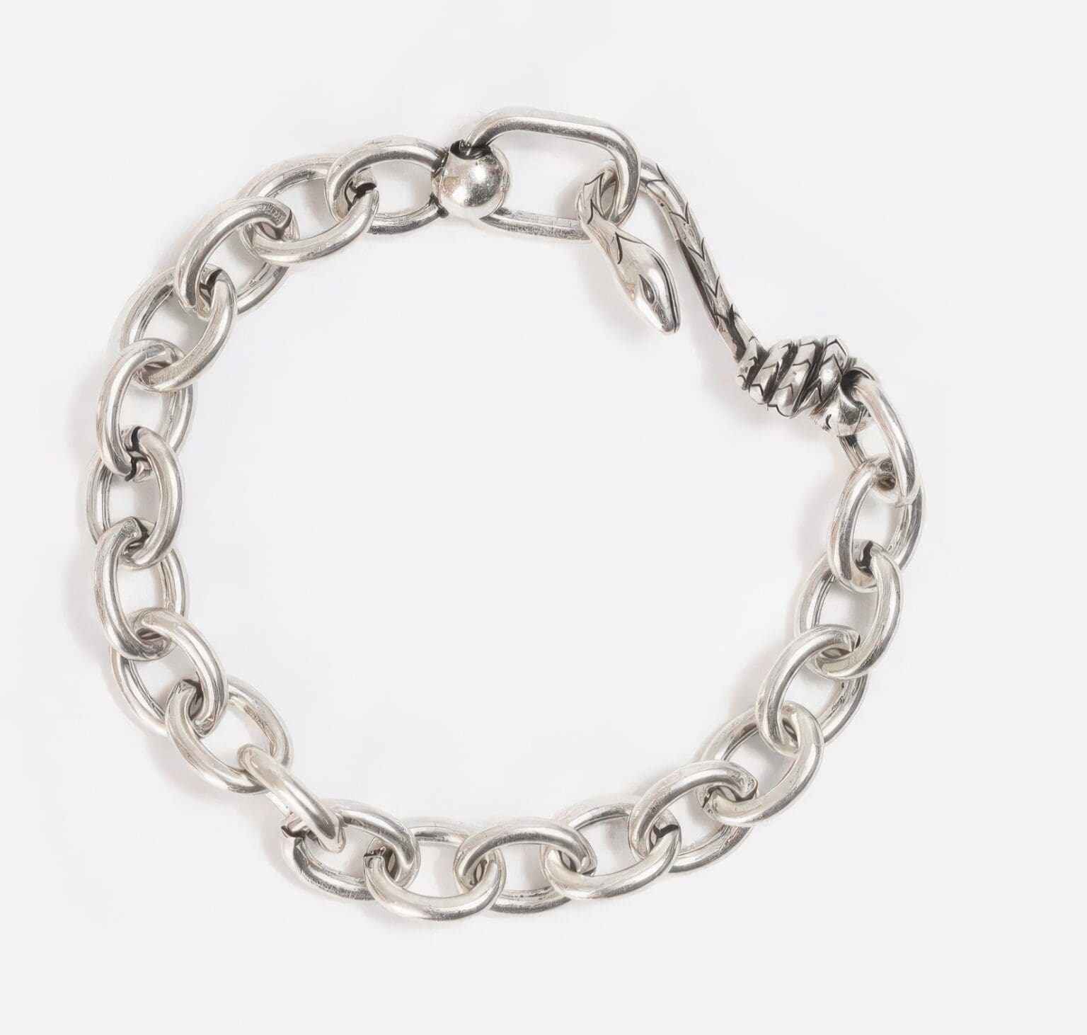 A silver chain bracelet with a metal clasp.