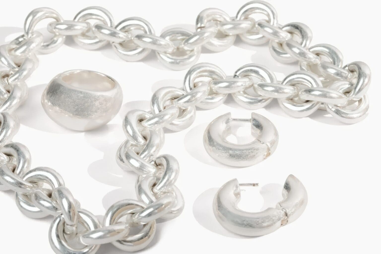 A close up of chains and rings on a table