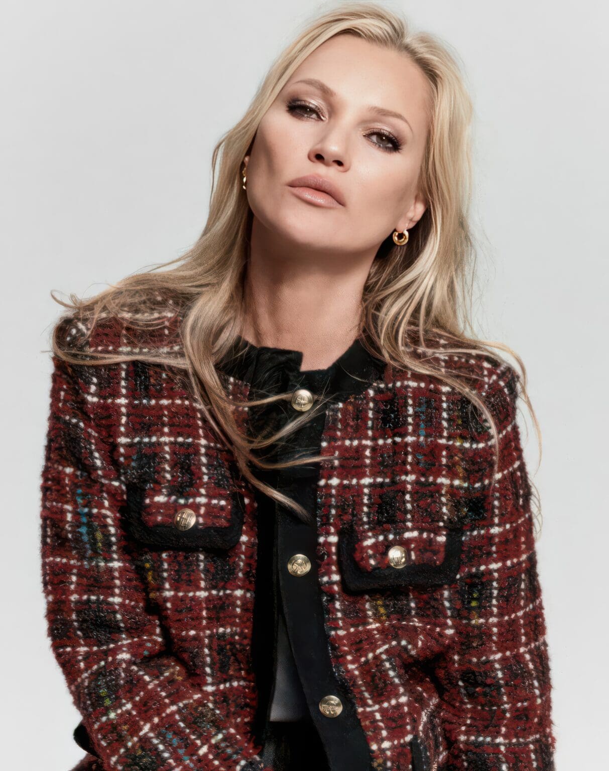 A woman in a red and black jacket