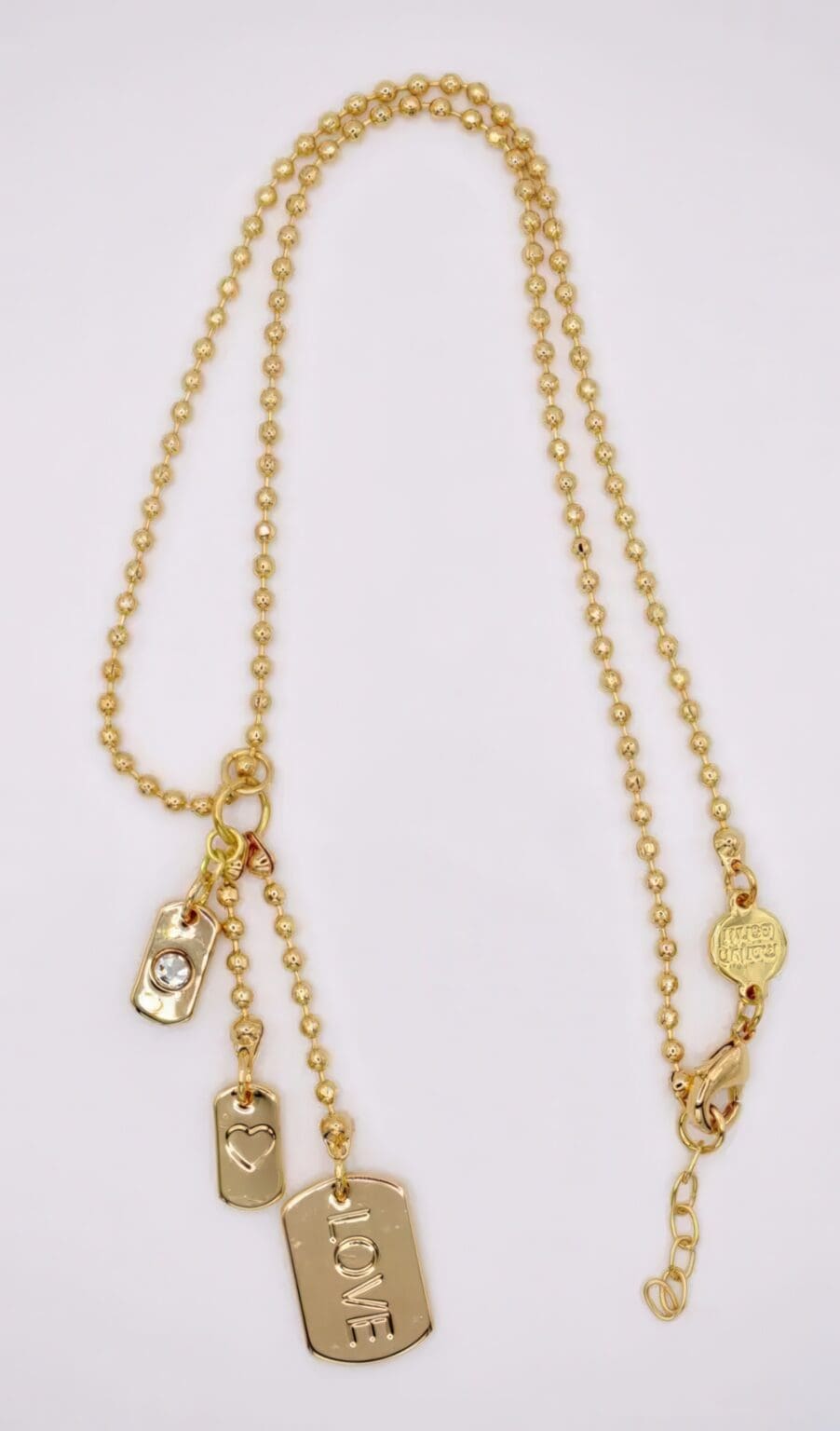 A gold chain with multiple chains and charms.