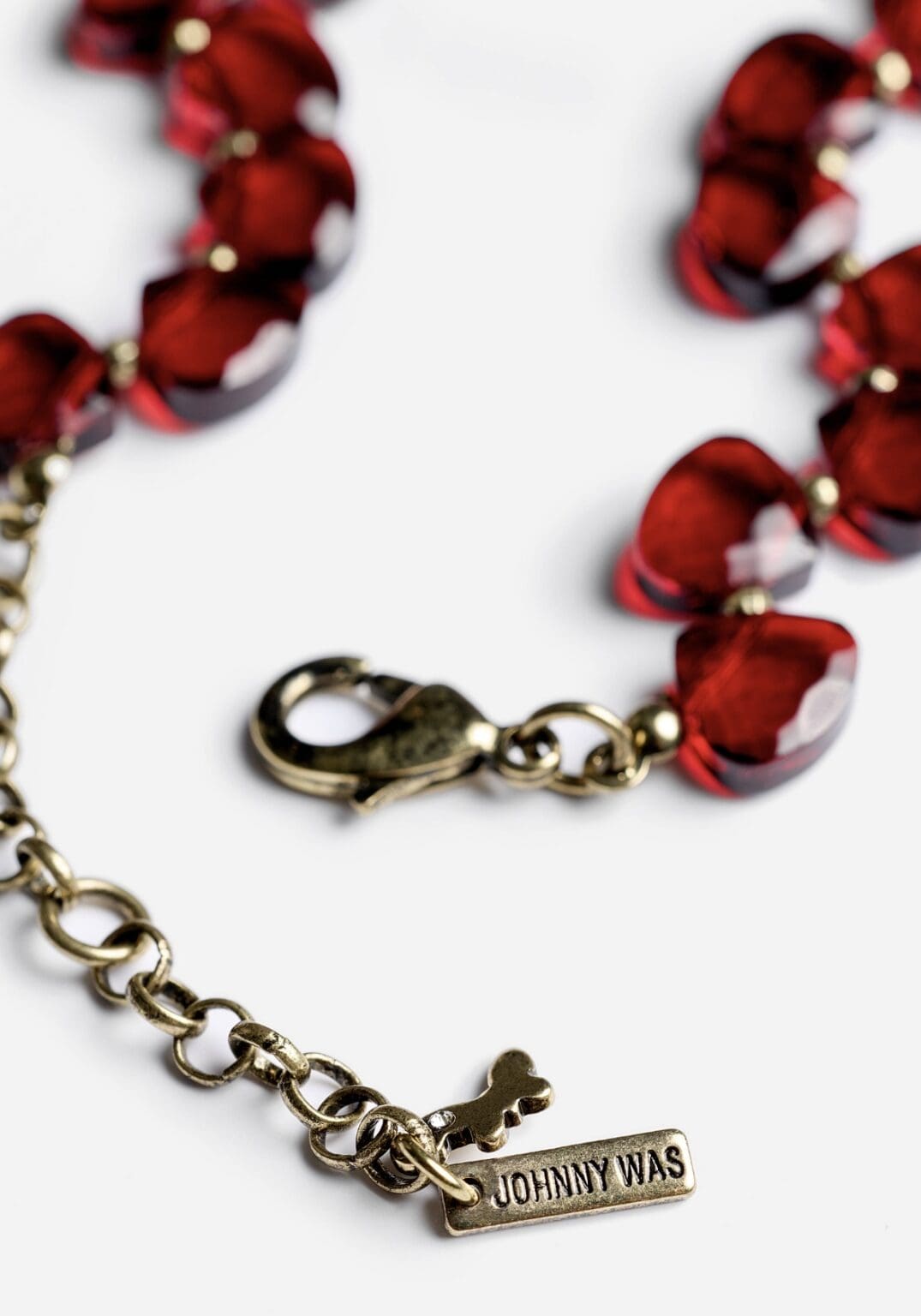Red beaded necklace with metal clasp.